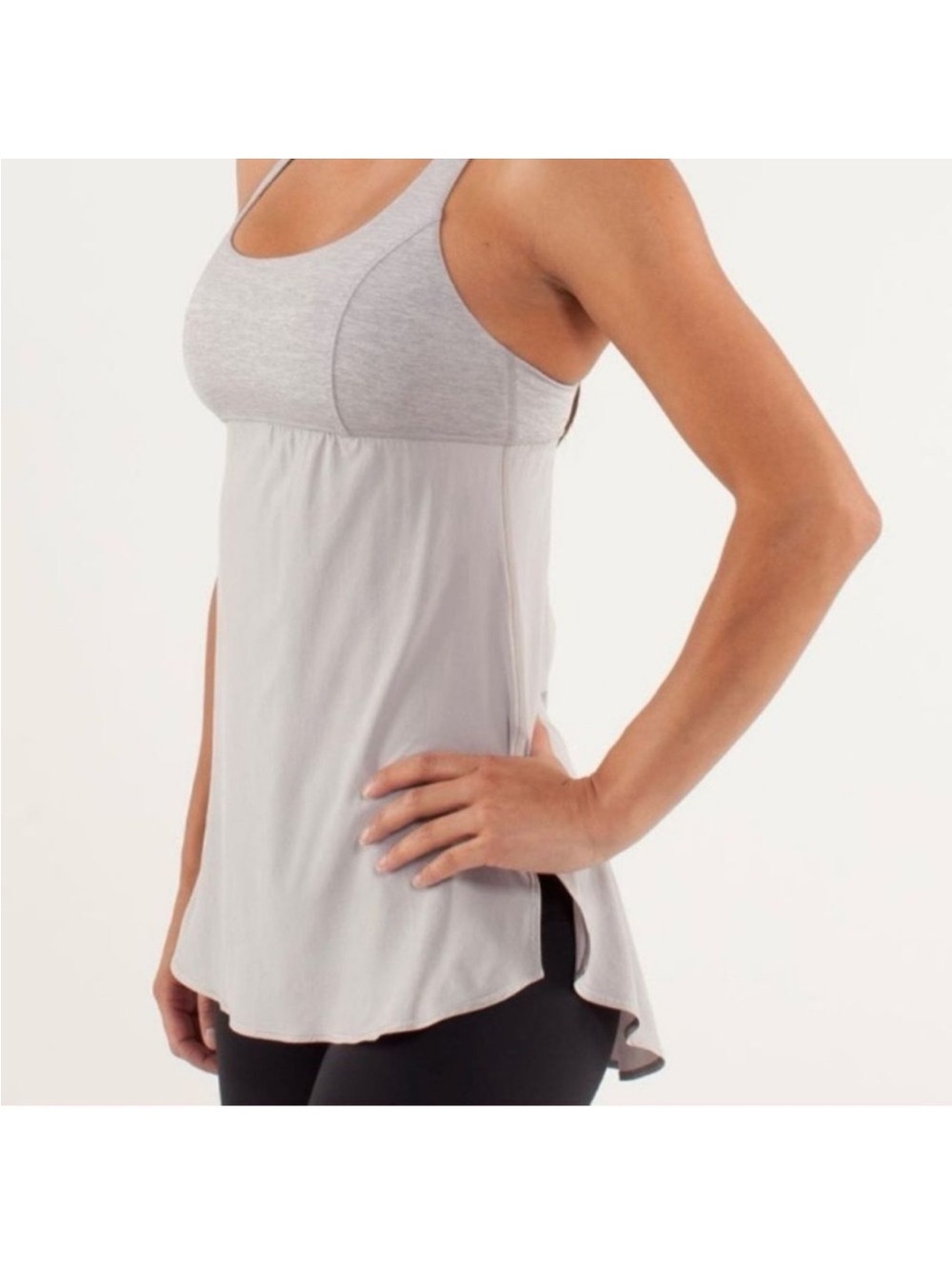 Lululemon Venus Tank features a built-in bra and a unique twist-back Size 4